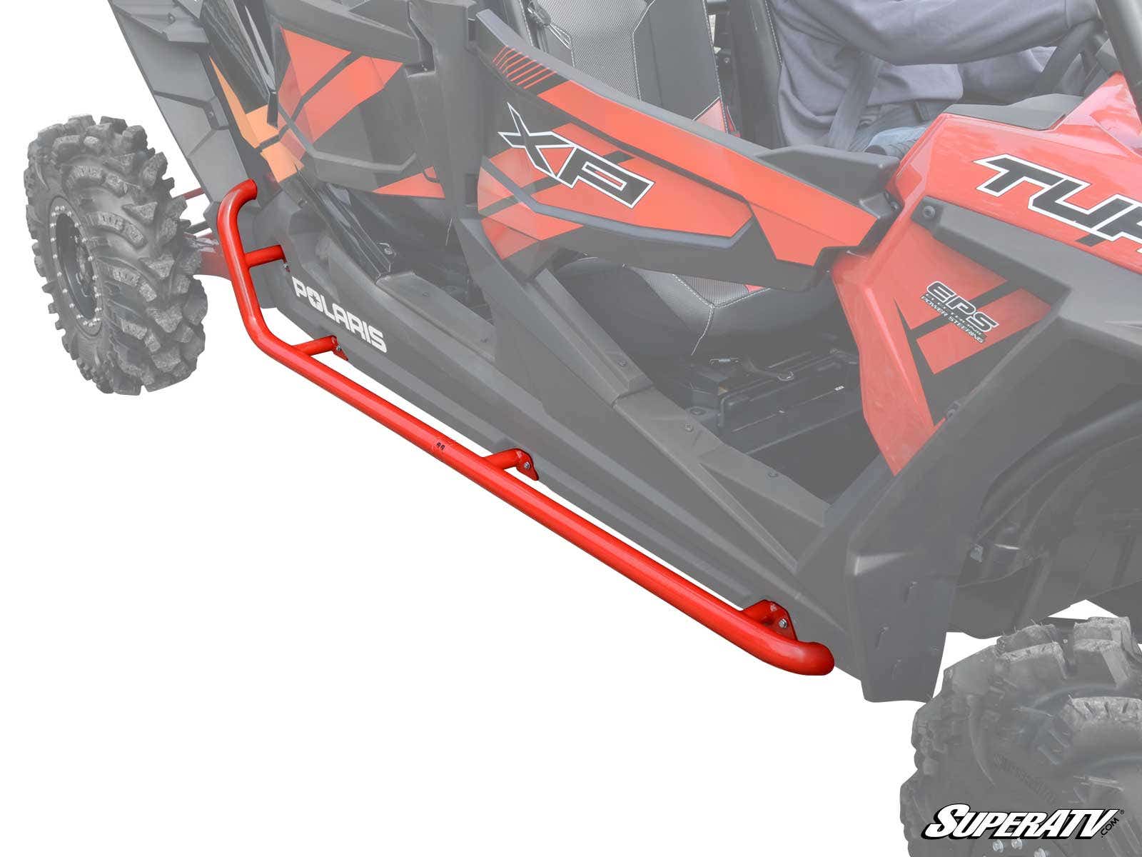 A red Polaris RZR XP 4 Turbo with metal Rock Sliding Nerf Bars is shown. The tubular nerf bars protect the lower side panels between the wheels, and the SuperATV logo appears at the bottom right.