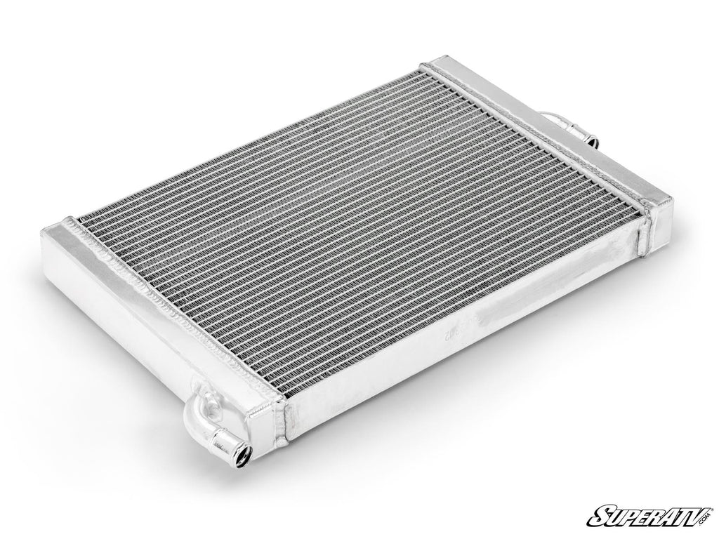 The Up & Running Polaris RZR XP Turbo S Radiator is a rectangular aluminum radiator with tightly packed fins, visible end tanks, and two hose connections, shown on a white background with the SuperATV logo in the bottom right corner.