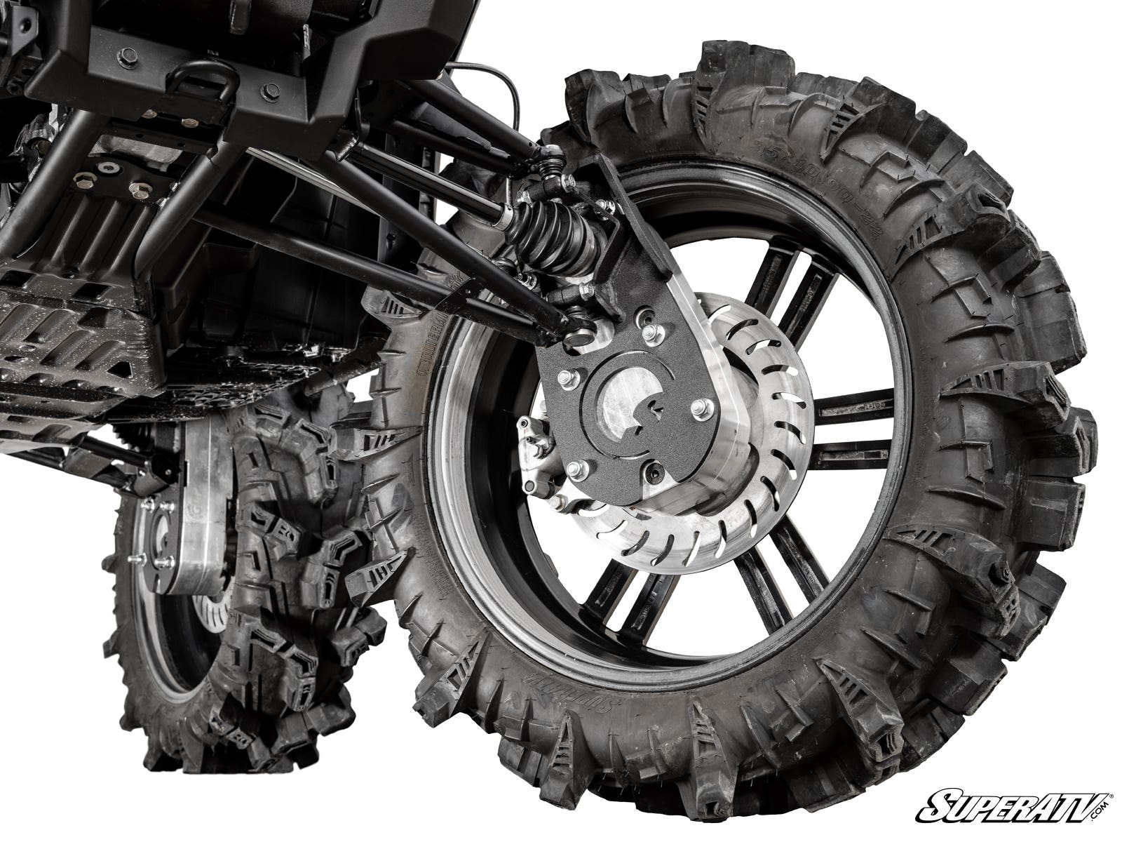 Close-up of a Polaris Scrambler 8 Portal Gear Lift showing the off-road suspension, large deep-tread mud tires, wheel’s disc brake, rugged control arms, and shock absorber. “SuperATV” branding is visible in the bottom right corner.