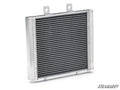 The Up & Running Polaris Sportsman Radiator is rectangular with horizontal fins, featuring two top mounting brackets and two bottom attachment pegs. The SuperATV logo is in the lower right, all set against a white background.