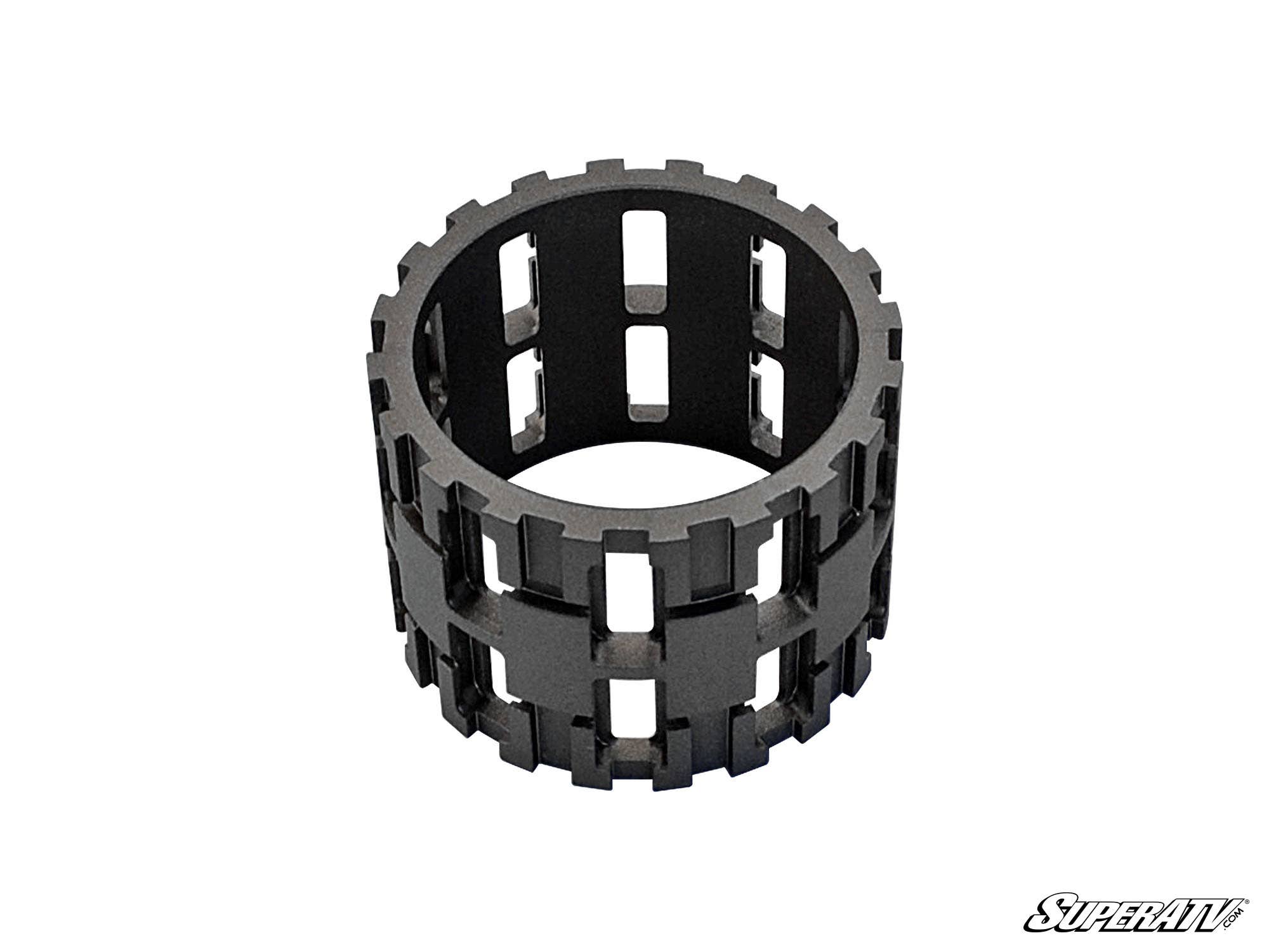 A polished, cylindrical black Polaris Sprague Carrier / Front Roller Cage features rectangular cutouts in rows, resembling a roller bearing. It’s shown on a white background with the SuperATV logo in the bottom right corner.