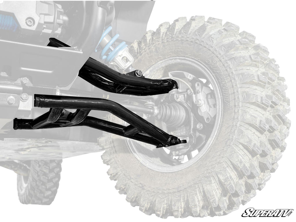 The Polaris Xpedition Atlas Pro 1 Forward Offset A-Arms are installed on an off-road vehicle. The A-arms are vibrant while the rest, including the rugged tire, is gray. The SuperATV logo appears at the bottom right.