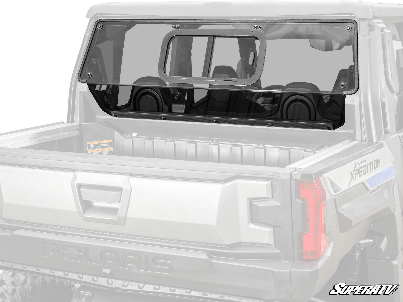 A Polaris Xpedition XP Sliding Rear Windshield, featuring clear polycarbonate and a sliding window, is installed with black hardware on the rear cab of a Polaris Xpedition. The empty truck bed and SuperATV logo are visible in the bottom right corner.