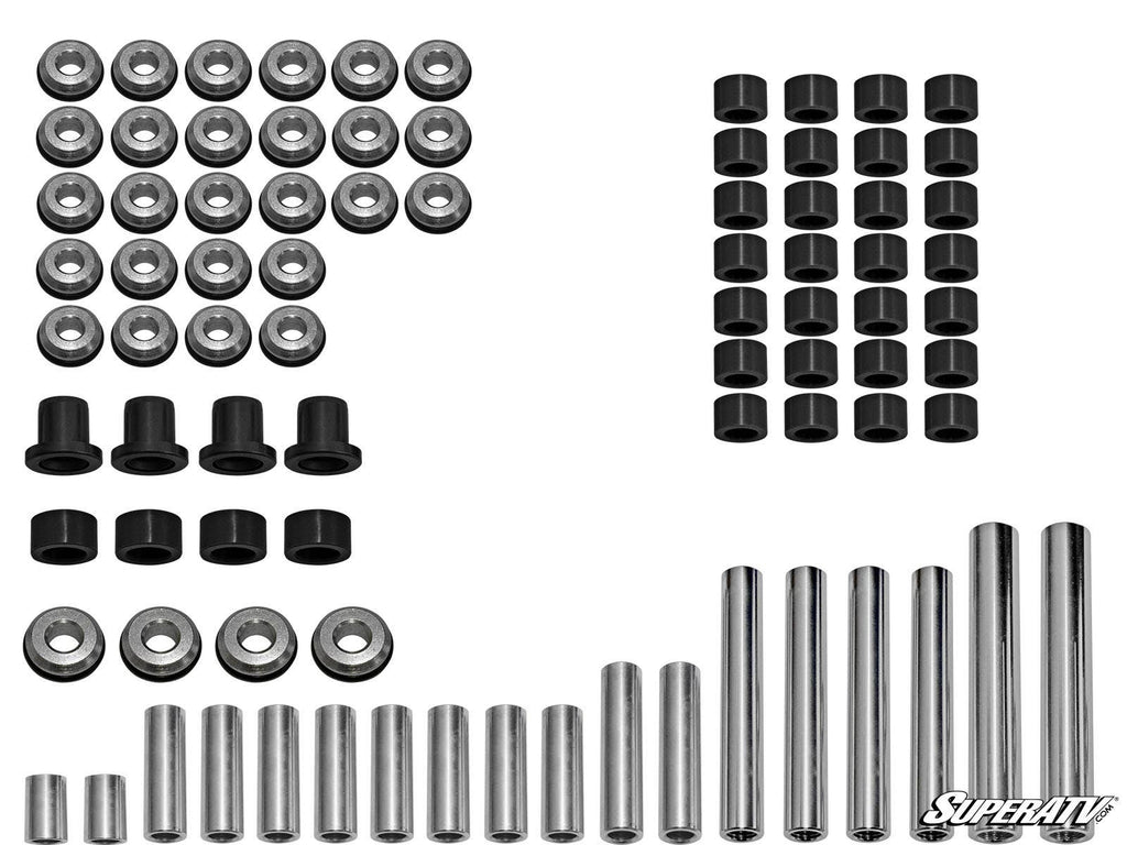 Polaris General A-Arm Bushings, including metal washers, black cylindrical bushings, hex spacers, and metal rods, are neatly arranged in rows on a white background. The SuperATV logo appears in the bottom right corner.