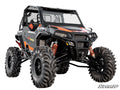 A Polaris General XP 1000 featuring a 4-6 Lift Kit, black and orange colors, large knobby tires, roll cage, reinforced bumper, red coil-over shocks, and the SuperATV logo shown in the bottom right.