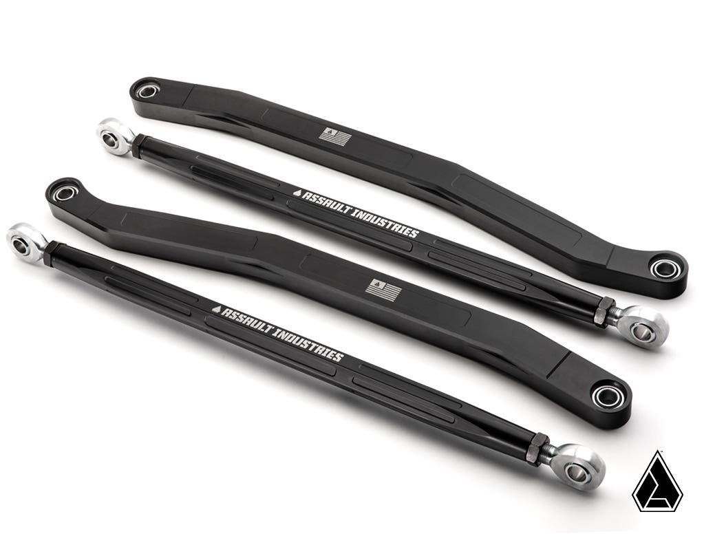 Three black Assault Industries Polaris RZR Pro R High-Clearance Billet Aluminum Radius Arms with silver ends lie on a white surface, each labeled in white. The rods differ in shape and length. A triangular logo is in the bottom right corner.