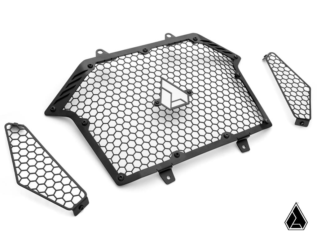 The Assault Industries Polaris RZR Turbo R Stinger Grille set includes three black metal mesh guards with a honeycomb design—one large center piece with a geometric logo and two smaller side pieces—all shown on a white background.