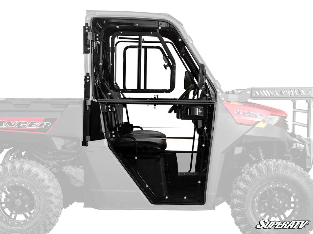 Side view of Polaris Ranger 1000 Convertible Cab Enclosure Doors in black metal and glass, featuring a clear window, black frame, visible hinges, and latch on a Polaris Ranger utility vehicle with a mostly transparent background.
