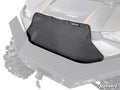 A Polaris Ranger XP 1000 Grille Cover in black mesh is mounted on the front of a gray off-road vehicle with rugged tires, an angular hood, and the SuperATV logo visible in the bottom right corner.