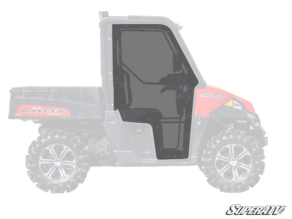 A side view of a Polaris Ranger 500 with large, rugged tires, showing the SuperATV Polaris Ranger Midsize Cab Enclosure Door—dark-tinted and windowed—highlighted on the cab. The SuperATV logo appears in the bottom right corner.