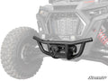 The Polaris RZR XP Turbo S Winch-Ready Front Bumper, shown in black with angled bars and a mesh center, is displayed with a tow hook and winch against a faded ATV background. SuperATV branding is visible in the lower right corner.
