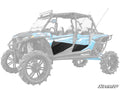 A blue four-seat Polaris RZR XP 4 ATV is shown with large off-road tires, a roof light bar, and SuperATV black aftermarket Polaris RZR XP 4 Turbo Lower Doors on a white background with the SuperATV logo in the lower right corner.