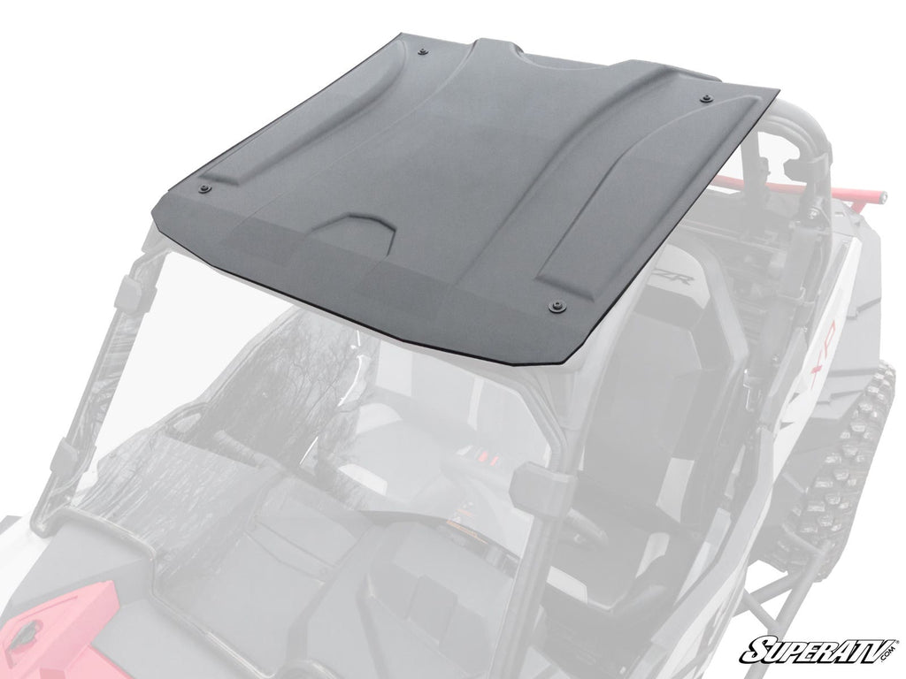 A Polaris RZR 900 Plastic Roof in black molded plastic is mounted on a partially visible off-road side-by-side with red accents. The roof stands out against the faded, transparent vehicle. The SuperATV logo appears in the bottom right corner.