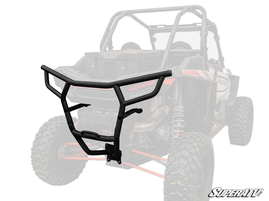A Polaris RZR XP Turbo Rear Bumper in black, with angular lines and mounting brackets, is shown in full color over a faded off-road UTV image. The SuperATV logo appears in the bottom right corner, highlighting its protective design.