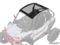 An overhead view of a white off-road vehicle with large tires showcases the Polaris RZR Trail 900 Tinted Roof, emphasizing the black-tinted polycarbonate roof while the rest of the vehicle is faded. The SuperATV logo appears in the bottom right corner.