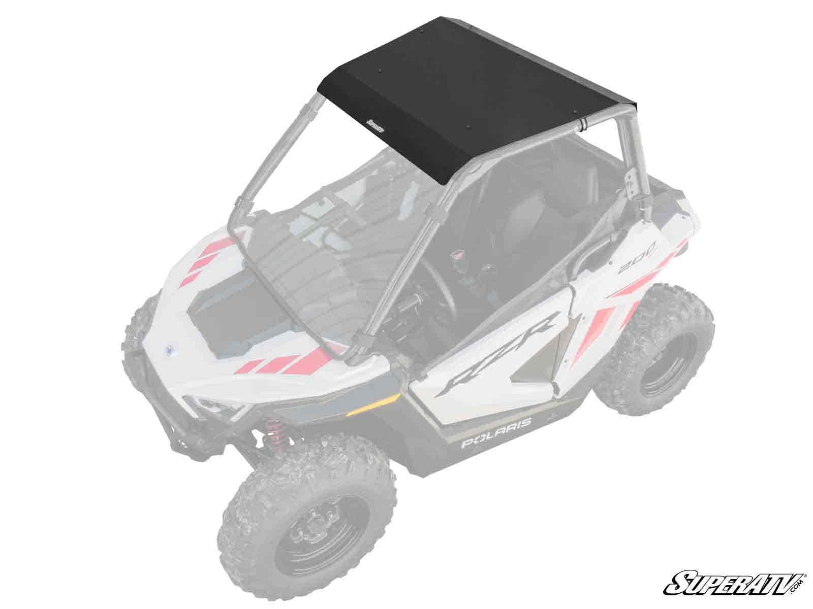 A Polaris RZR 200 Aluminum Roof is installed on a Polaris off-road side-by-side with a faded body, making the solid, rectangular black roof stand out. The SuperATV logo appears in the bottom right corner of the image.