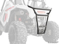 The Polaris RZR 200 Rear Bumper is shown installed on a white off-road UTV with large rugged tires and exposed suspension. The black metal bumper features a protective grill and sturdy frame, mounted over the rear tires and engine area.