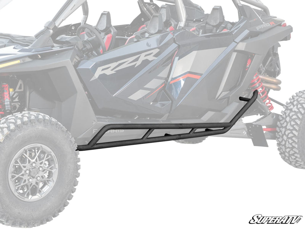 A Polaris RZR Pro R 4 Heavy-Duty Nerf Bar with a black, angular, rugged metal design is installed along the side of a Polaris RZR off-road vehicle, with the grayscale background emphasizing the nerf bar in the foreground.