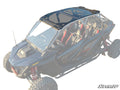 A Polaris RZR Pro R 4 with a tinted roof and windshield is shown at an angle. It has red and black seats, rugged tires, visible suspension, and a roll cage. SUPERATV branding appears in the lower right corner.