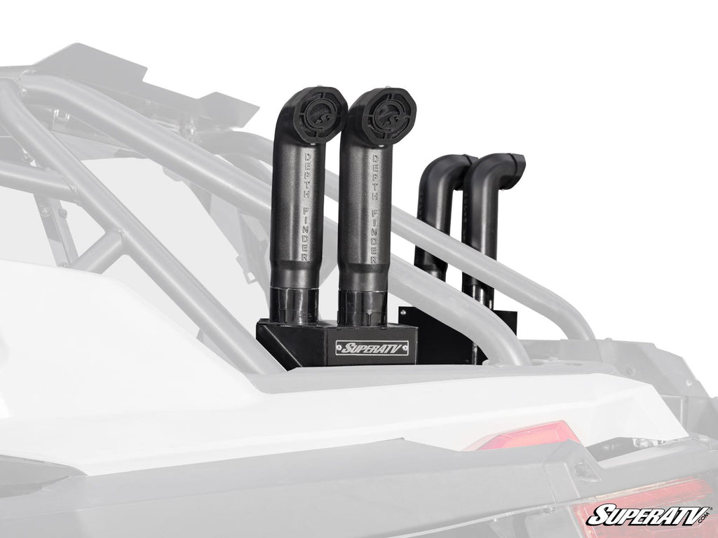 A close-up shows two black snorkel tubes labeled “SuperATV,” mounted upright in a vehicle’s rear cargo area. The background is faded to highlight the Polaris RZR PRO XP Depth Finder Snorkel Kit and SuperATV logo on the mounting plate.
