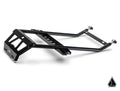 The Assault Industries Adventure Rack for Polaris RZR PRO XP / Turbo R / Pro R / Pro S is a black metal subframe with angular support bars, a rectangular mounting plate, attachment points, bolts, and a geometric logo in the lower right corner.