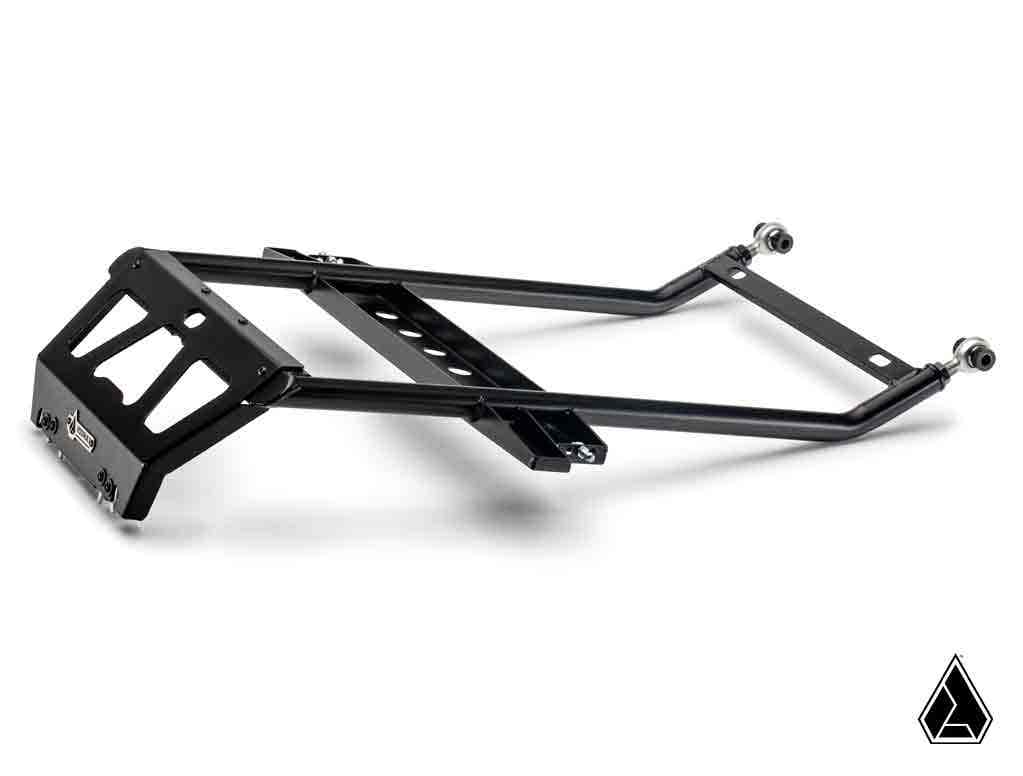 The Assault Industries Adventure Rack for Polaris RZR PRO XP / Turbo R / Pro R / Pro S is a black metal subframe with angular support bars, a rectangular mounting plate, attachment points, bolts, and a geometric logo in the lower right corner.