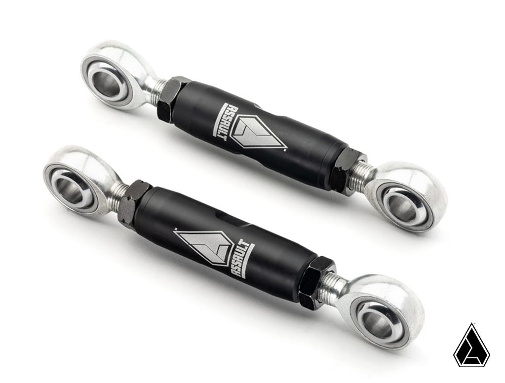 Two black Assault Industries Front Barrel Sway Bar End Links (Fits: RZR Turbo S // Pro XP) with silver joints and hex locknuts are shown on a white background. Each rod features the “FIRMNT” name and silver geometric logo; a triangular company logo is in 