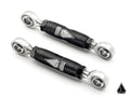 Two black Assault Industries Front Barrel Sway Bar End Links (Fits: RZR Turbo S // Pro XP) with silver joints and hex locknuts are shown on a white background. Each rod features the “FIRMNT” name and silver geometric logo; a triangular company logo is in 