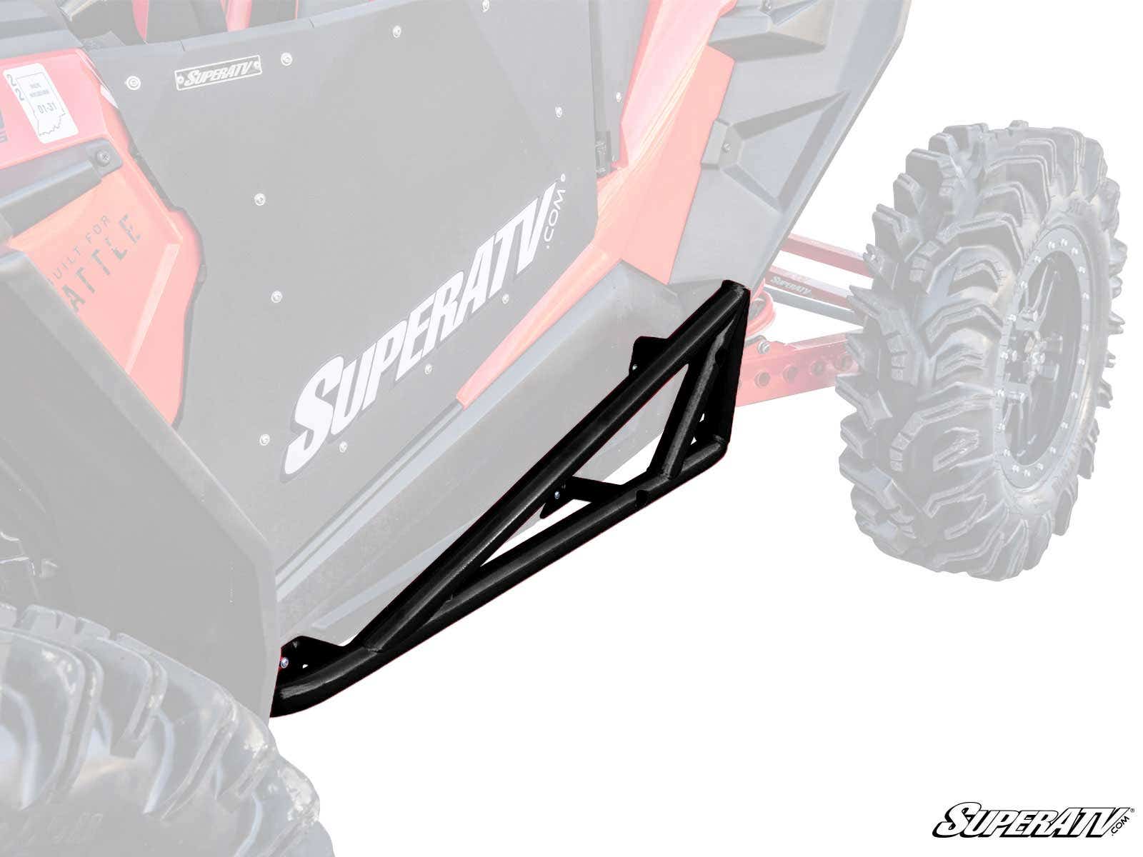 Polaris RZR XP Turbo S Nerf Bars in black metal are mounted along the side of a red off-road vehicle with large rugged tires, featuring “SuperATV” branding. The faded background draws attention to the nerf bars’ design and placement.