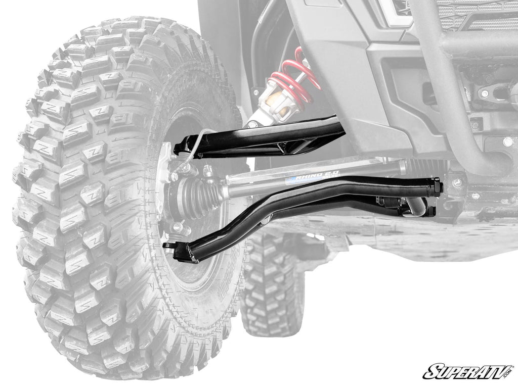 A close-up of Polaris RZR XP Turbo Atlas Pro 1.5 Forward Offset A-Arms, highlighting the detailed black A-arms, red-spring shock absorber, and rugged tire tread, with the rest of the vehicle faded to emphasize these parts.