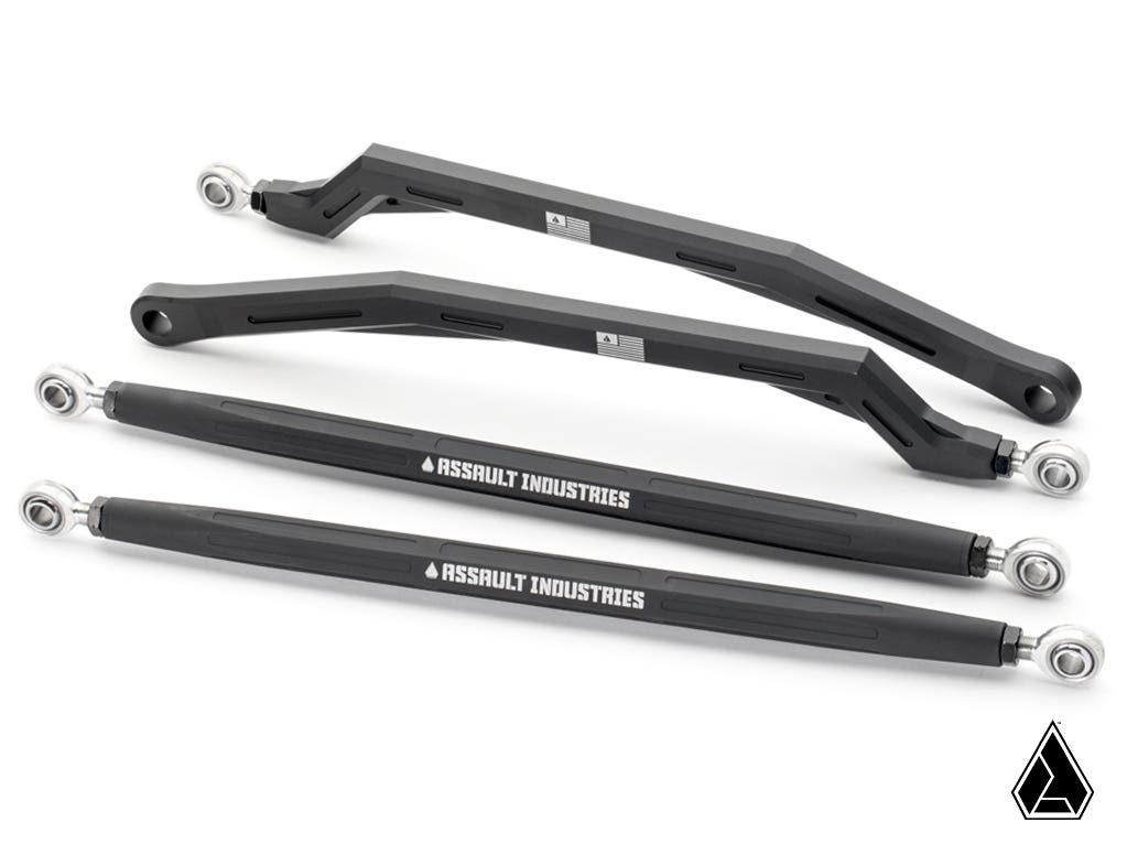 Four black metal Assault Industries Polaris RZR XP High-Clearance Quick-Camber Radius Arms with silver rod ends—two angled, two straight—are displayed on a white background with the Assault Industries logo in the bottom right corner.