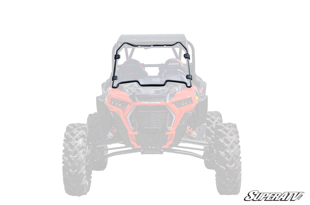A Polaris RZR XP Turbo S Scratch-Resistant Full Windshield is installed on a red Polaris RZR side-by-side, with the windshield and mounting hardware shown in full color, the vehicle faded, and the SuperATV logo in the bottom right.