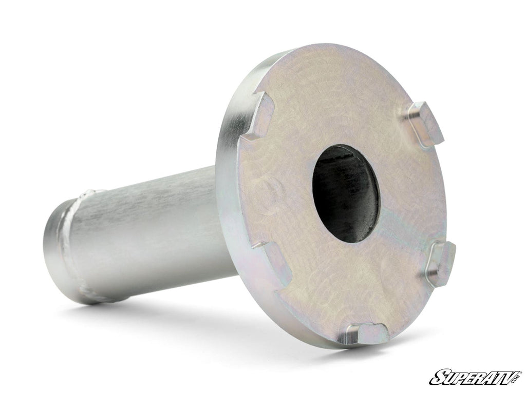 The Snorkel Tube Backlash Tool is a metal cylinder with a wide, flat, notched end featuring six evenly spaced rectangular protrusions and a central hole. It is shown on a white surface with the SuperATV logo in the bottom right corner.