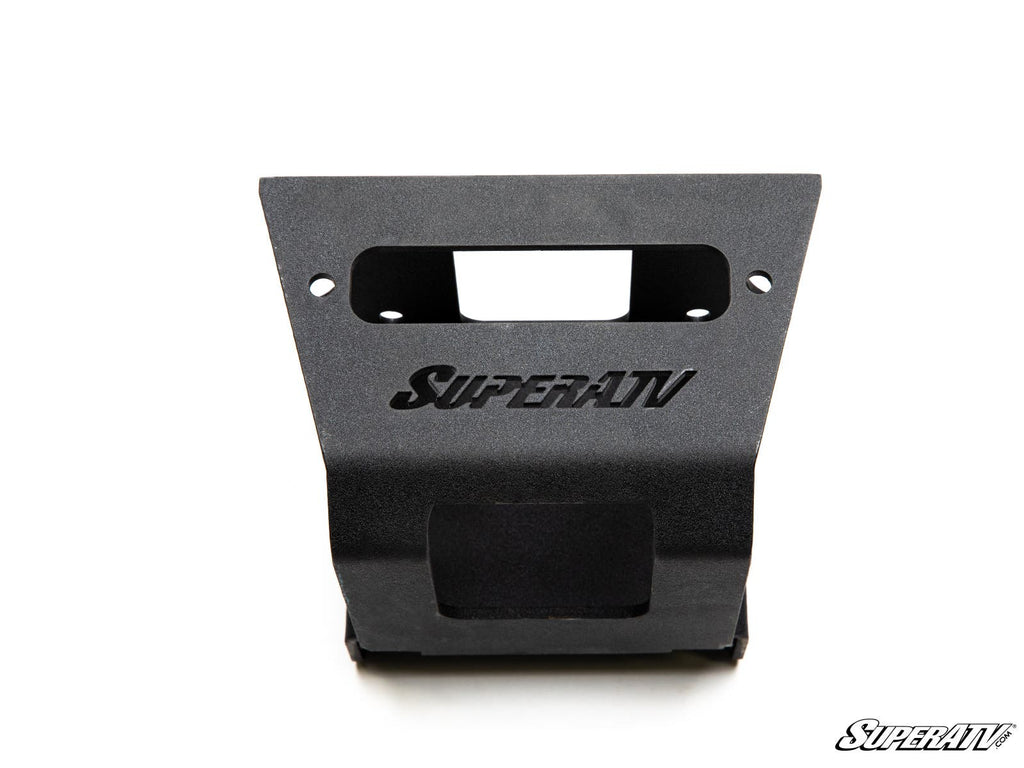 A black Polaris Sportsman Winch Mounting Plate with SuperATV cut out in the center, mounting holes at the top, and a rectangular opening below. The SuperATV logo appears in the bottom-right corner on a plain white background.