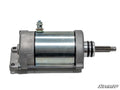 A Polaris General Starter with a metallic cylindrical body, mounting flange, bolt, and protruding shaft is shown on a white background. The SuperATV logo is in the lower right corner.