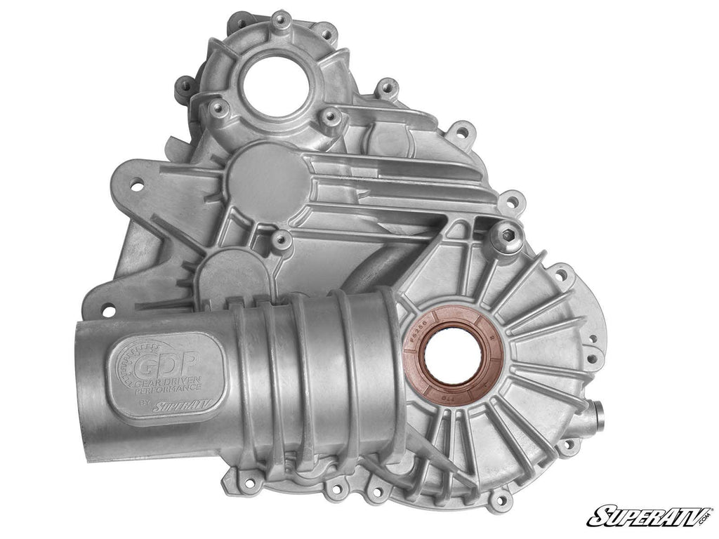 A clean, unused Polaris RZR XP 1000 Transmission Case made of silver aluminum with circular openings, ridges, and an embossed “GDP” logo on the left. Shown on a white background with the SuperATV logo in the bottom right corner.