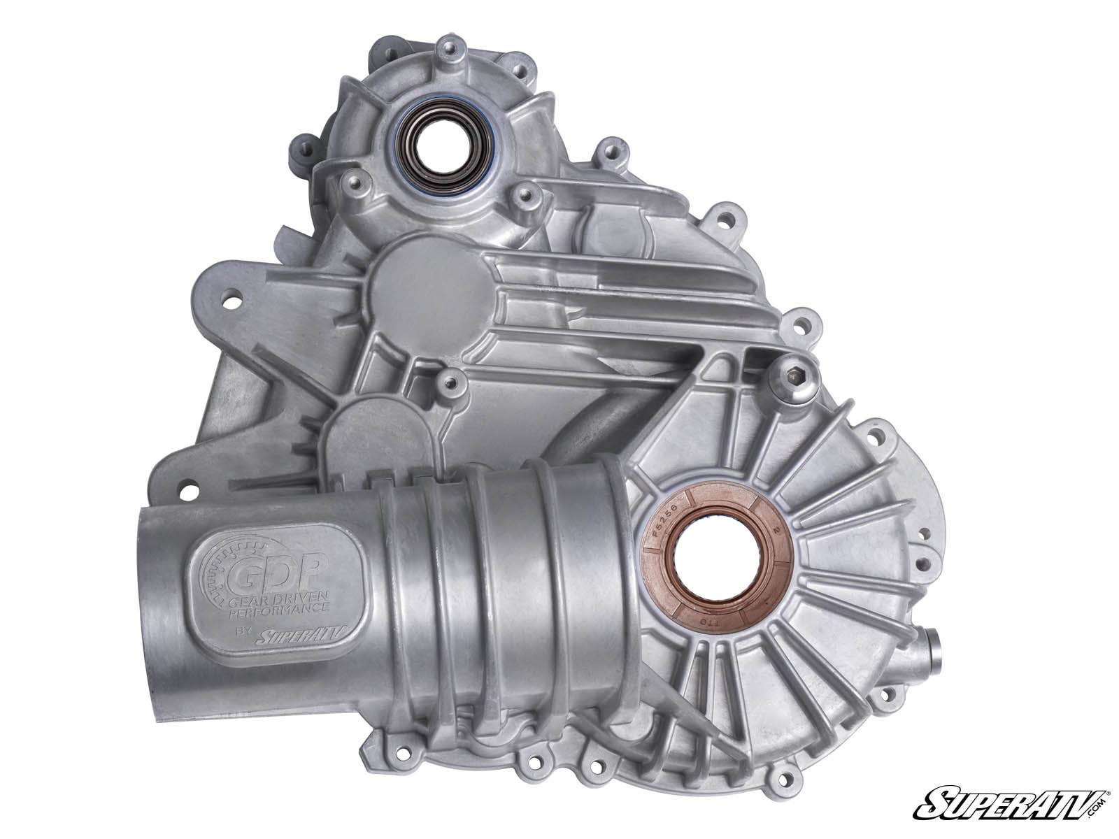 The Polaris General XP 1000 Transmission Case is a silver aluminum automotive part with ribbed and smooth sections, visible bolt holes, two circular bearing housings, and an embossed “GDP Gear Driven Performance by SuperATV” logo with the SuperATV logo bo