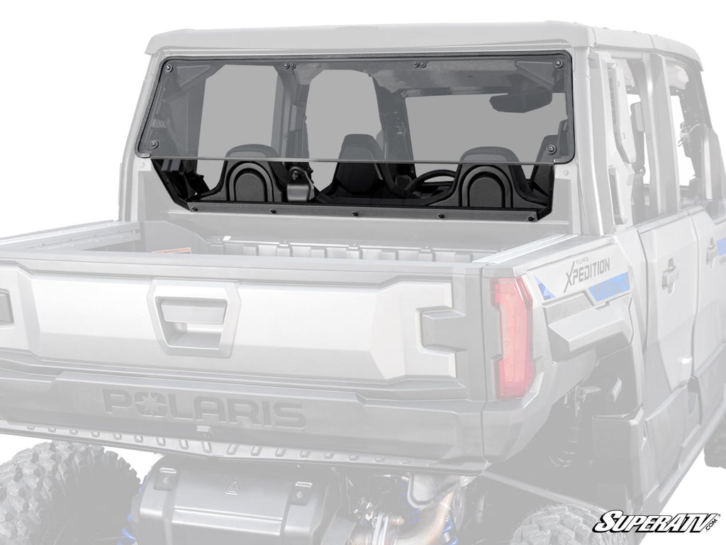 A Polaris Xpedition XP Rear Windshield, tinted and clear with black edges, is installed on an off-road utility vehicle, covering the rear cabin window. Two black seats are visible inside, with the SuperATV logo in the bottom right corner.