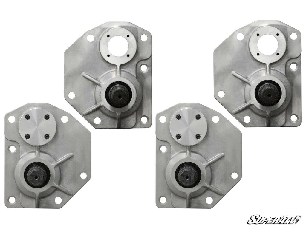 Four silver, flat metal parts with black centers and bolt holes are arranged on a white background. Each has an industrial look and is a component of the Honda Portal Gear Lift Conversion Kit - Gen 1 To Gen 2. SuperATV logo appears in the corner.