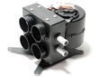 The Inferno Cab Heater Kit with Defrost for 2019-current Polaris RZR XP Pro is a compact black unit with four round vents, two metal hoses, visible wiring, and a sturdy bracket, designed for vehicle climate control. Photographed on a white background.
