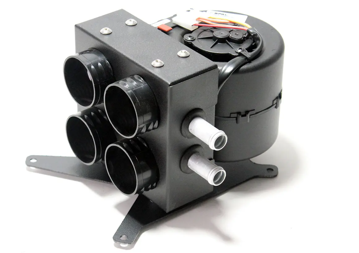The Inferno Cab Heater Kit with Defrost for 2019-current Polaris RZR XP Pro is a compact black unit with four round vents, two metal hoses, visible wiring, and a sturdy bracket, designed for vehicle climate control. Photographed on a white background.
