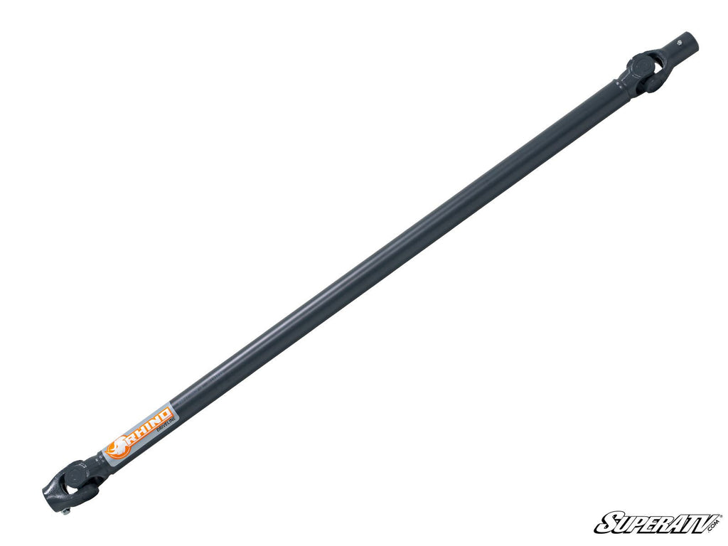 A black, cylindrical metal Can-Am Maverick X3 Heavy-Duty Prop Shaft (Rhino Driveline) with U-joint yokes, an orange RHINO logo near one end, and a white SUPERATV logo at the bottom right on a plain white background.