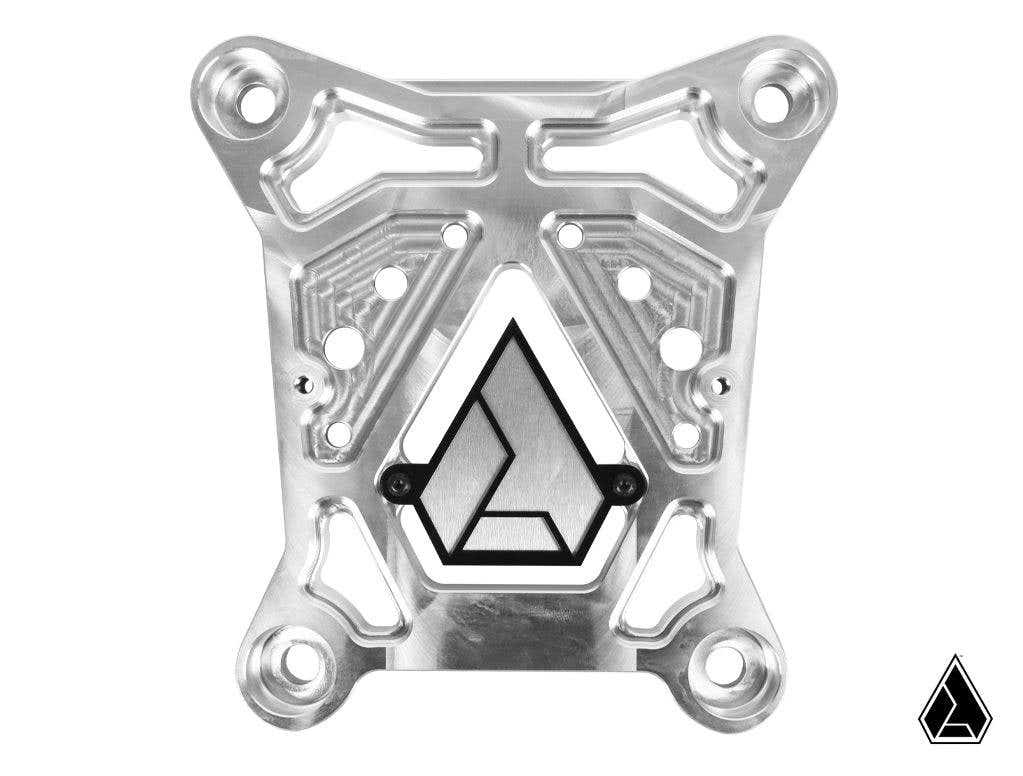 The Assault Industries Stinger Billet Radius Rod Reinforcement Plate (Fits: Pro XP) is a precision-engineered silver metal plate with geometric cutouts, rounded corners, and black outlined triangular logos on a white background.