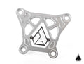 The Assault Industries Billet Radius Rod Reinforcement Plate (Fits: Turbo S) is a silver, geometric metal bracket with four rounded mounting holes, detailed cutouts, and a black and silver angular logo centered on a clean white background. The logo repeat
