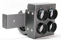 The Inferno Cab Heater Kit With Defrost for 2018-Current Polaris Ranger 1000 & 1000 XP features four round black sensors in a square layout, sturdy L-shaped mounting bracket, visible screws, and a partially visible rear fan against a white background.