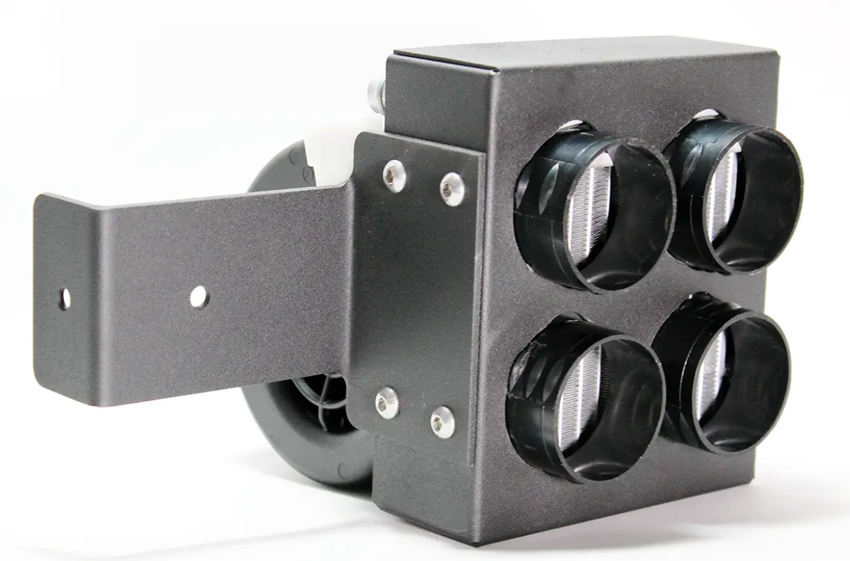 The Inferno Cab Heater Kit With Defrost for 2018-Current Polaris Ranger 1000 & 1000 XP features four round black sensors in a square layout, sturdy L-shaped mounting bracket, visible screws, and a partially visible rear fan against a white background.
