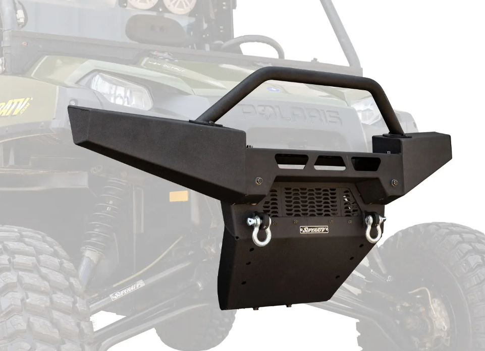 A close-up of the Polaris Ranger XP Winch Ready Front Bumper, featuring a rugged black metal build with a skid plate and two D-ring mounts, shown on a green Polaris off-road vehicle equipped with large tires and a winch.