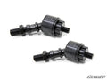 Two black, cylindrical SuperATV Inner Tie Rod End Replacements for Yamaha, featuring threaded bolts and hex nuts, are placed diagonally on a white background. The SuperATV logo is at the bottom right. The parts have a durable, machined look.