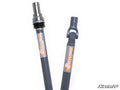 Two heavy-duty gray Polaris Ranger XP 1000 Rhino Driveline prop shafts with RHINO logo and orange rhino head graphic. Left shaft has a silver splined end with a seal; right shaft features a universal joint. SuperATV logo shown bottom right.