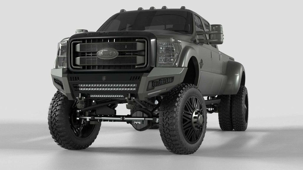A 2011-2016 Ford F-250 with a matte gray lift and big off-road tires features the Identity Front Bumper Full Kit—center section shackle, wide end pods, X3 cube light pods, accent lights, and black ring—for a rugged look.